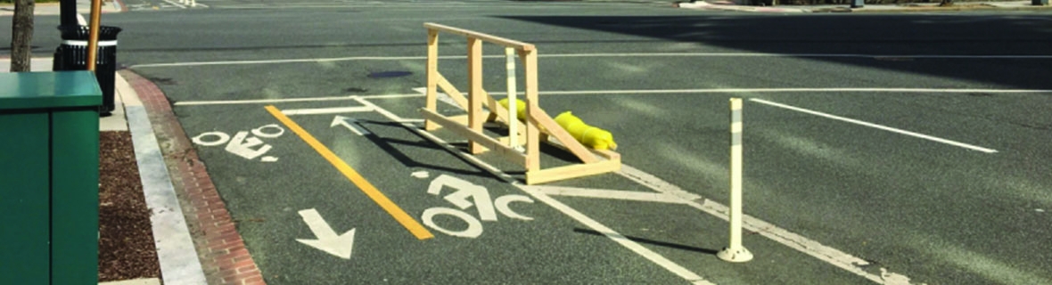 Wooden handstand on bike lane. Photo by DCDOTRA.