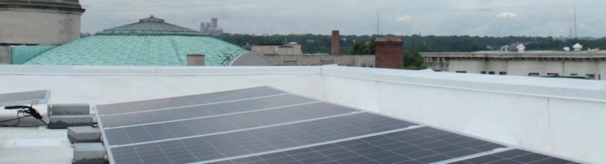Solar panels on a city rooftop