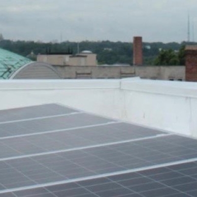 Solar panels on a city rooftop